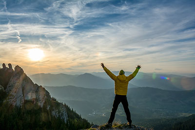 a man standing on top of a mountain